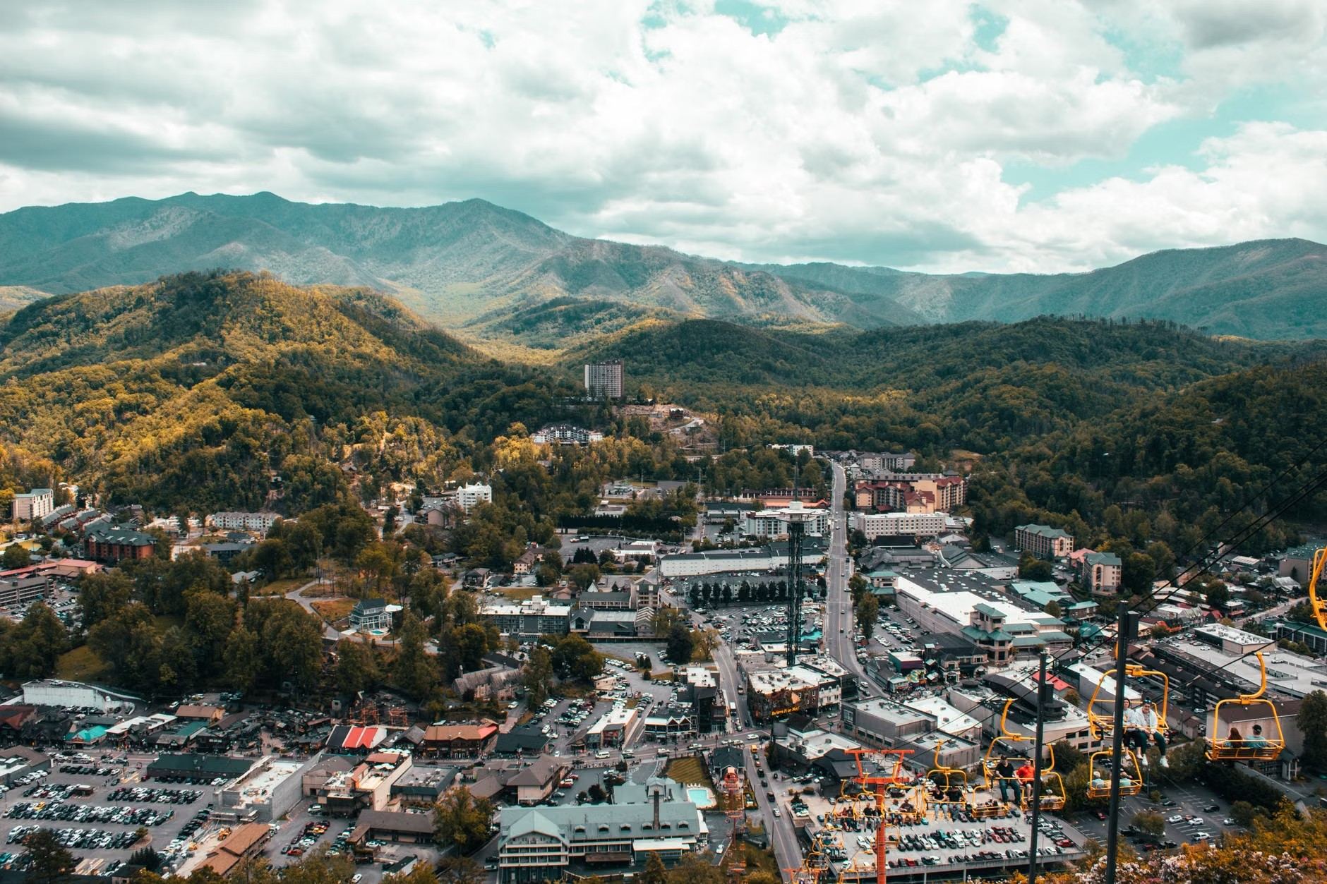 Downtown Gatlinburg, Tennessee, with the Space Needle and the Great Smoky Mountains behind it